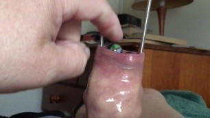 Foreskin with tongs plus 13 ball bearings, 13 marbles