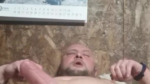 Russian bear plays with penis and cums without hands