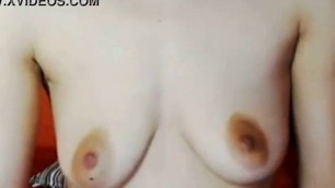 Cam girl shows off her small saggy tits